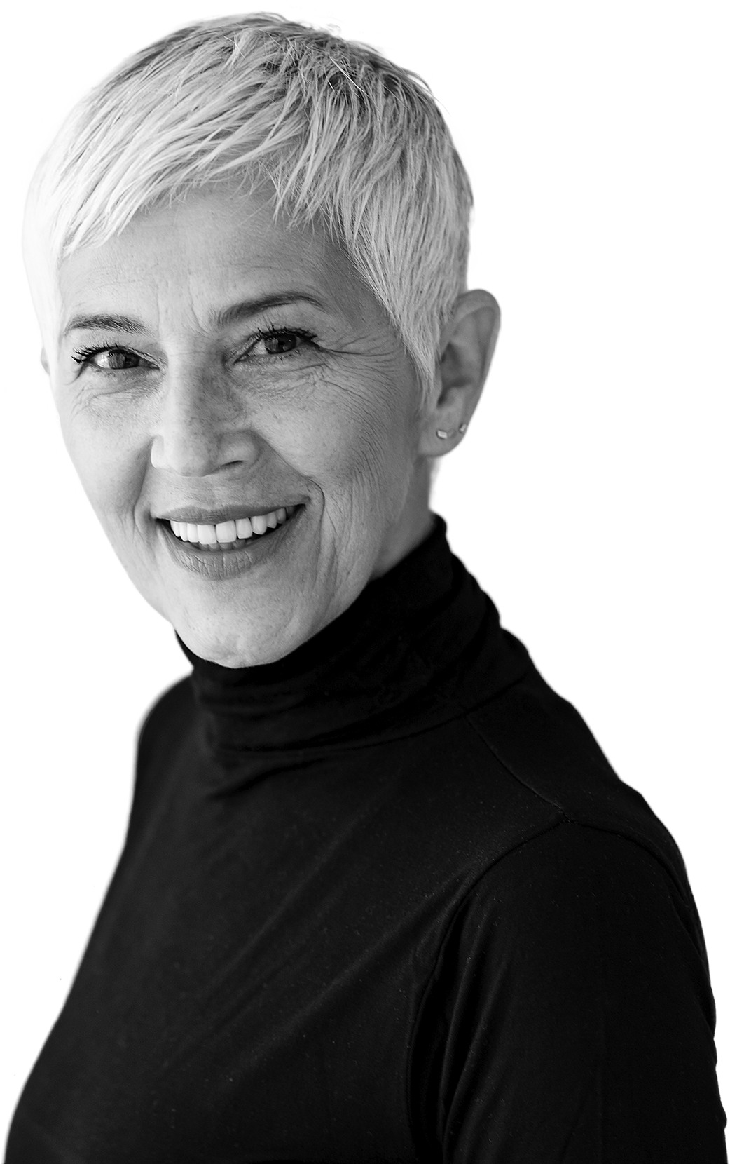 Woman with short light hair in a black turtleneck smiling